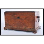 A Victorian rosewood sarcophagus shaped tea caddy, with a quarter reel moulded border, hanging