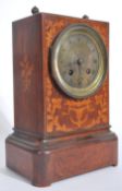 A vintage 19th century marquetry sea weed inlaid mantel clock with brass movement marked for