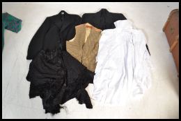 A good collection of vintage clothing dating to the early 20th Century to include a ladies lace work