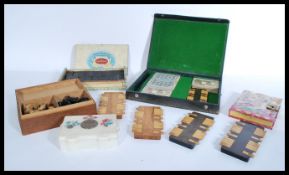 A collection of vintage 20th Century parlour game items to include several wooden whist scorers,
