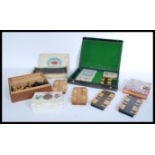 A collection of vintage 20th Century parlour game items to include several wooden whist scorers,