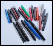 A collection of vintage fountain pens to include O