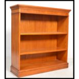 An early 20th century Yew wood bookcase being open fronted with multiple shelves. Please see images.