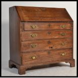 A Georgian 19th century mahogany bureau. Raised on