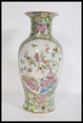 An early 20th century famille rose begonia shaped vase having hand painted decoration of birds ,