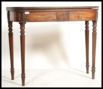 A Georgian 19th century mahogany inlaid tea table