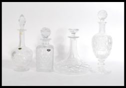 A group of vintage cut crystal glass decanters to