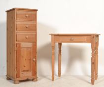 An antique style country pine writing table desk raised on turned legs together with a pedestal