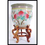 A 20th century large Chinese ceramic planter jardiniere, decorated with peaches and bats of