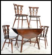 A vintage 20th Century Ercol beech and elm dining