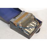 Musical Instruments. A vintage early 20th century Paulo Antonio piano accordion in faux marbled