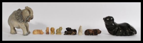 A collection of African carved soapstone figurines