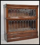 A 20th Century mahogany Globe Wernick two section lawyers bookcase, sections enclosed by leaded