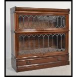 A 20th Century mahogany Globe Wernick two section lawyers bookcase, sections enclosed by leaded