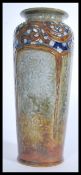 An early 20th century Royal Doulton salt glazed stoneware vase of tall form being tubelined