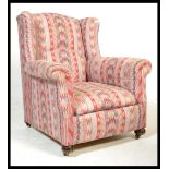 A good 19th century wingback armchair in the manne