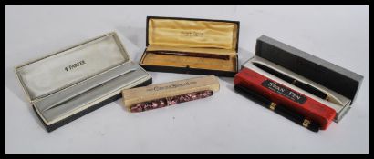 A group of vintage pens all in original boxes to i