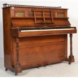 A Victorian Arts & Crafts mahogany and brass uprig