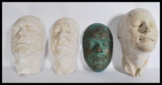 A group of four 20th century plaster death masks / art projects one signed to verso. Largest