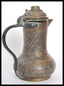 An 18th century middle eastern Persian Islamic brass and copper coffee pot Dallah, probably Turkish.