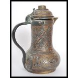 An 18th century middle eastern Persian Islamic brass and copper coffee pot Dallah, probably Turkish.