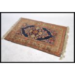 A vintage early 20th century floor rug decorated w