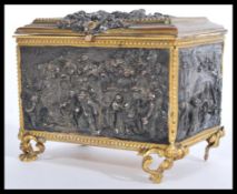 A19th century French gilt metal and bronze jewellery box of rectangular form, decorate with figure