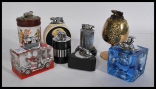 A collection of vintage table lighters to include