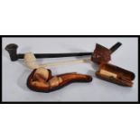 A good groups of vintage pipes to include a carved