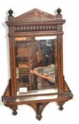 A 19th century rosewood and marquetry inlaid wall mirror shelf. Finial inlaid cornice over