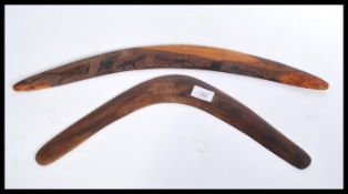 Two early 20th century hard wood Aboriginal boomerang weapons one of plain angular form and the