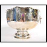 A large unused silver plated lion mast twin handled gadrooned edge pedestal punch bowl, stamped to