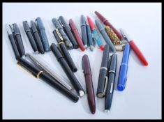 A collection of vintage fountain pens to include A