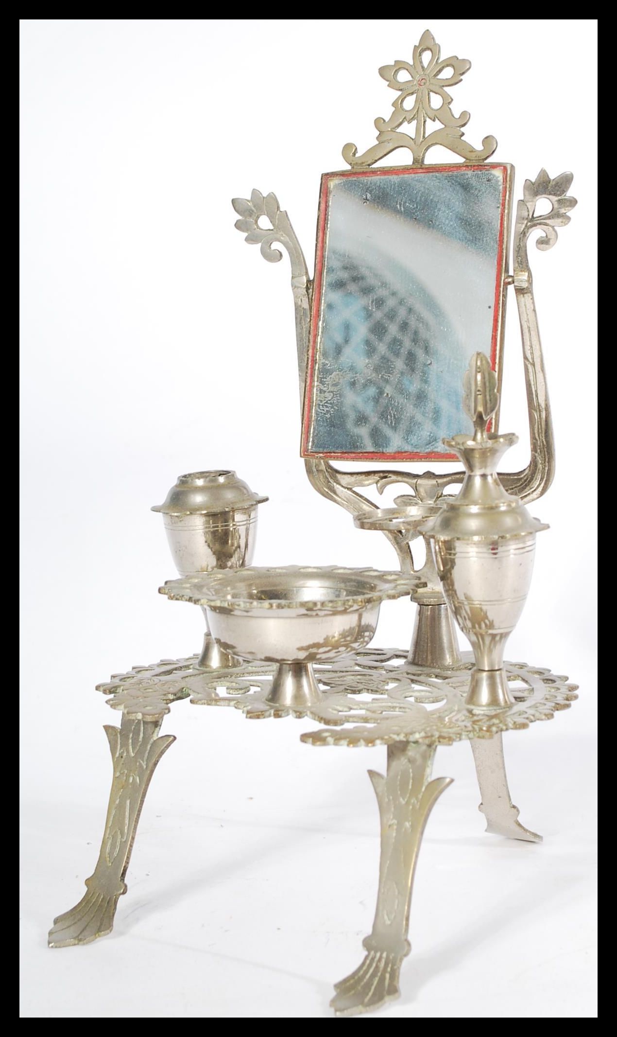 An apprentice piece silver plated dressing table i