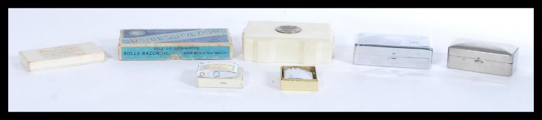 A group of vintage lighters and razors to include Everready Eclipse Rolls , Penguin and Ronson