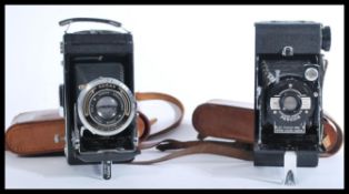 A vintage 20th Century leather cased folding Pengu
