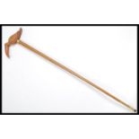 A vintage walking stick cane having a tapering Mal