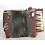 Musical Instruments. A vintage early 20th century  " Tonella " piano accordion in faux rosewood