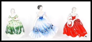 A group of three Coalport ceramic figurines of ladies to include Ladies of Fashion Blanche , Anna