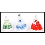 A group of three Coalport ceramic figurines of ladies to include Ladies of Fashion Blanche , Anna