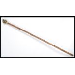 A vintage walking stick cane having a tapering pal