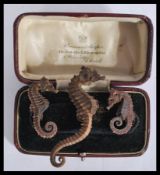 A collection of 3 early 20th century dried seahorses / seahorse to include 2 small and 1 larger.