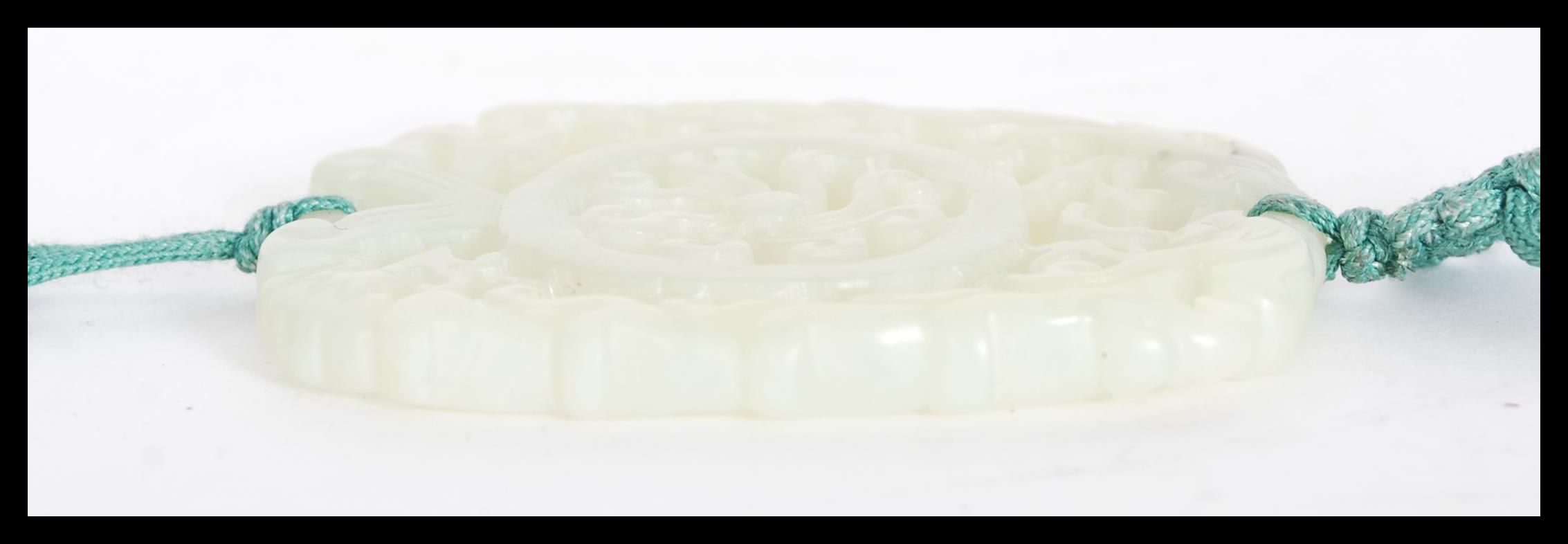 A Chinese carved jade double sided bi pendant havi - Image 4 of 5