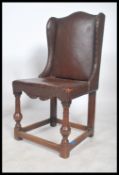 A 19th century Victorian leather wing back chair h