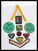 A collection of vintage scout badges - patches to