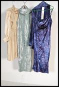 A collection of retro ladies clothing dating from the 1980's to include a  Black long evening