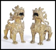 A pair of early 20th century Chinese gilt bronze t