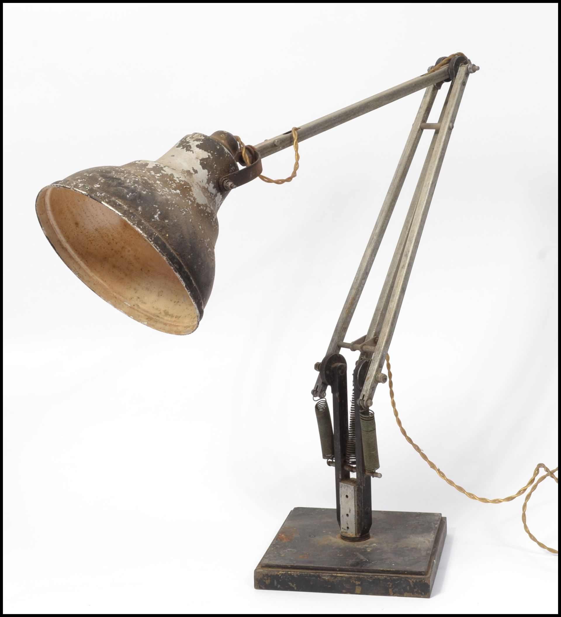 A 20th century Air Ministry stamped anglepoise Herbert Terry & sons desk lamp. Raised on squared