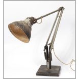 A 20th century Air Ministry stamped anglepoise Herbert Terry & sons desk lamp. Raised on squared