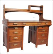 A superb 1930's Art Deco solid oak Air Ministry style twin pedestal desk. Raised on twin pedestals